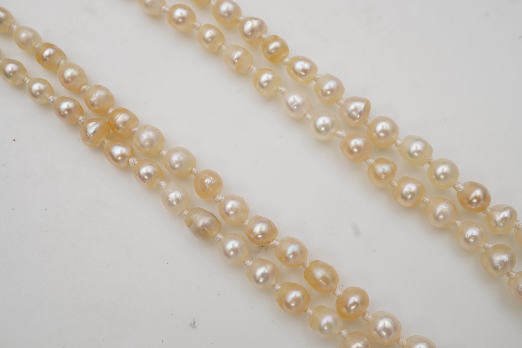 A natural pearl and diamond necklace, early 20th century